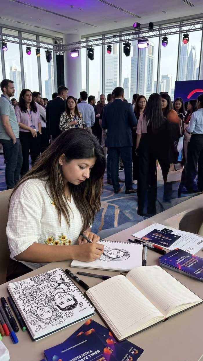 Aeman sketching guests live at a Dubai event