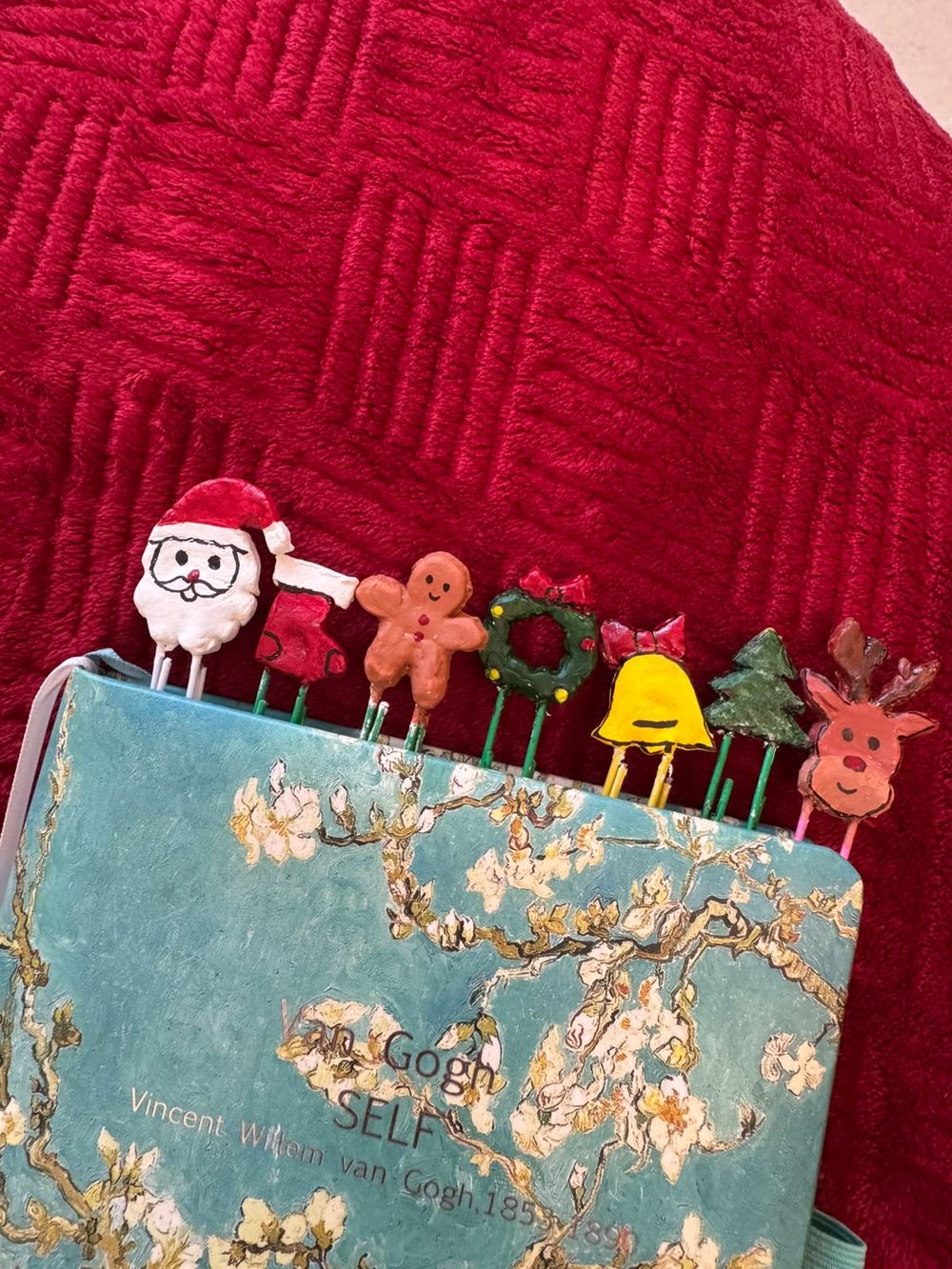 A set of hand-sculpted festive clay bookmarks from the Dakiya Christmas collection